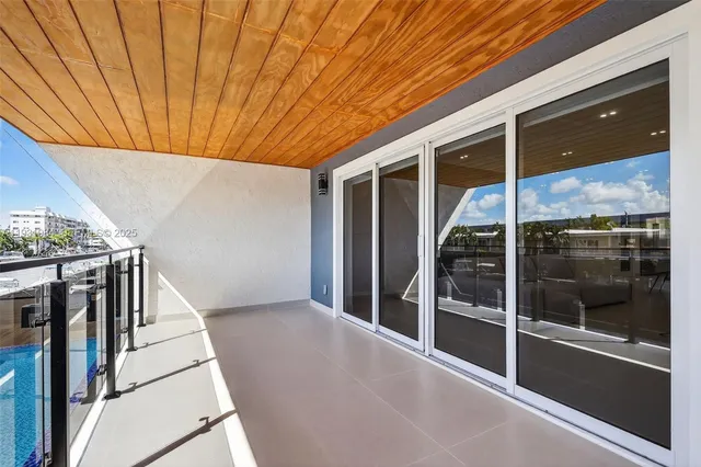 a spacious bedroom with a bed and a walk in closet