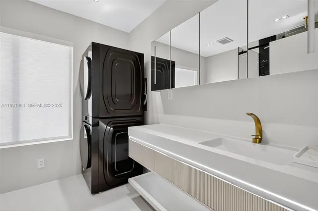 a bathroom with a shower and a sink
