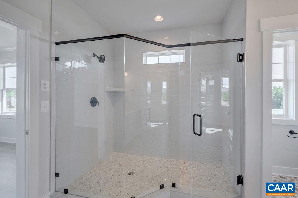 754 Arboleda Drive Crozet, VA 22932 - Photo 25 of 39 a bathroom with a shower and a mirror
