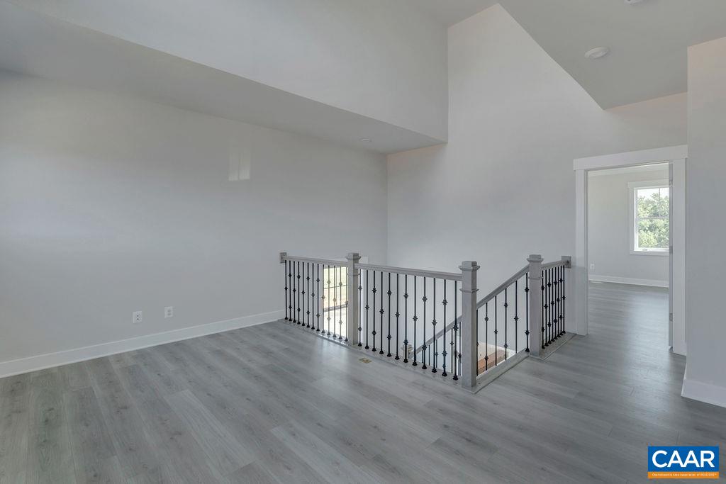 754 Arboleda Drive Crozet, VA 22932 - Photo 35 of 39 a view of a hallway with wooden floor