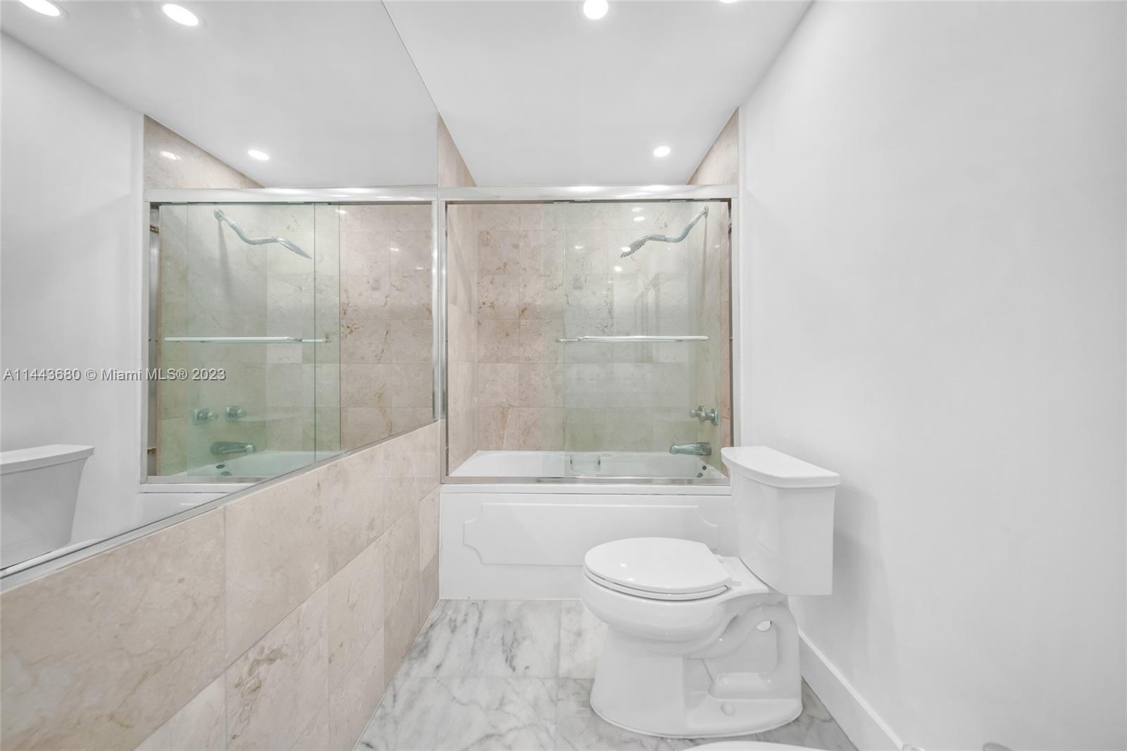 Brickell Key Miami, FL 33131 - Photo 15 of 40 a bathroom with a toilet and a shower