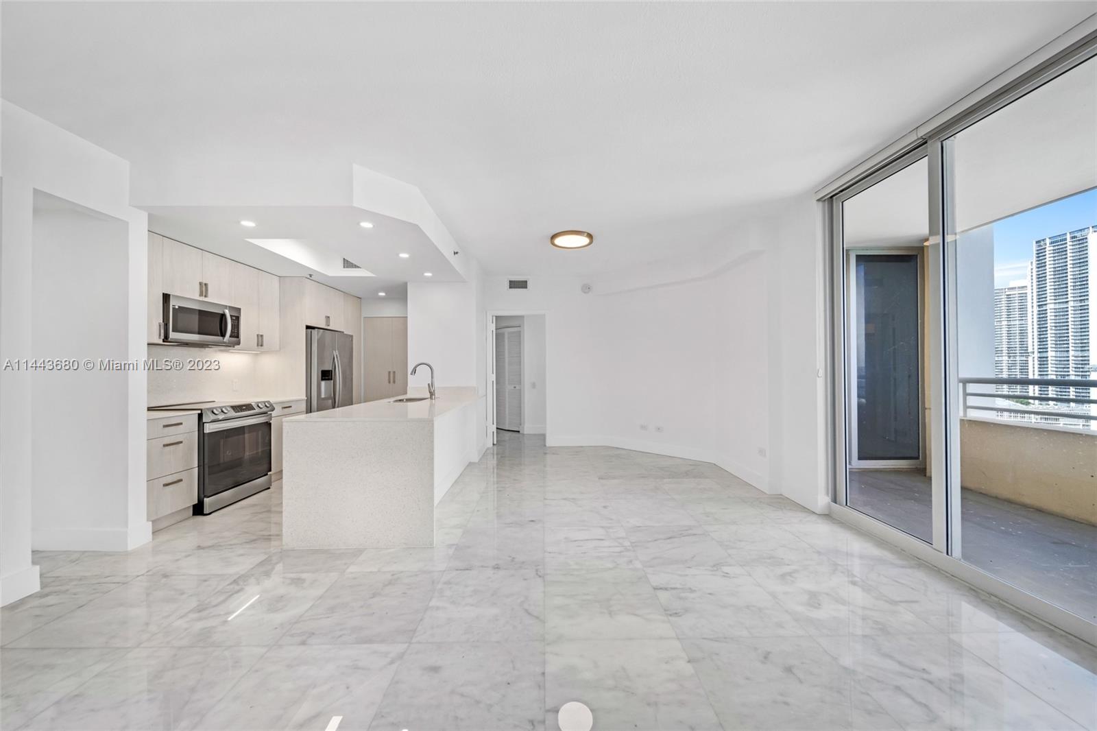 Brickell Key Miami, FL 33131 - Photo 18 of 40 a view of a kitchen with refrigerator and an oven