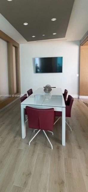 Brickell Key Miami, FL 33131 - Photo 37 of 40 a dining room with furniture and a flat screen tv
