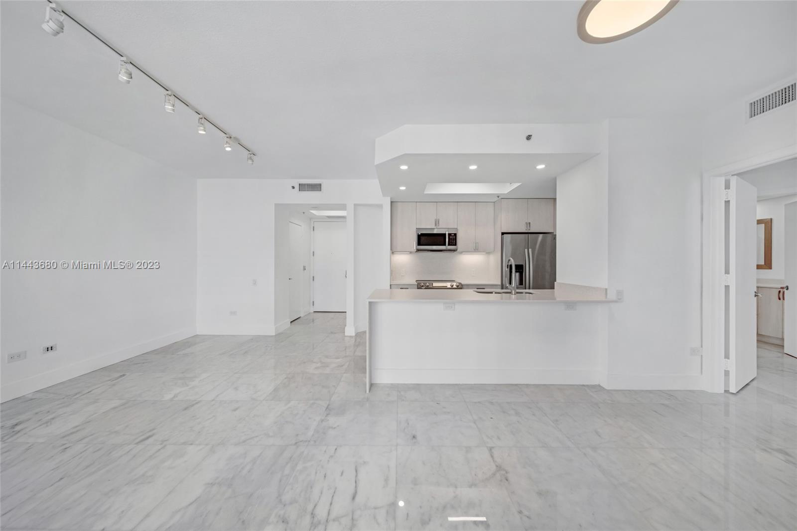 Brickell Key Miami, FL 33131 - Photo 8 of 40 a view of kitchen with white cabinets