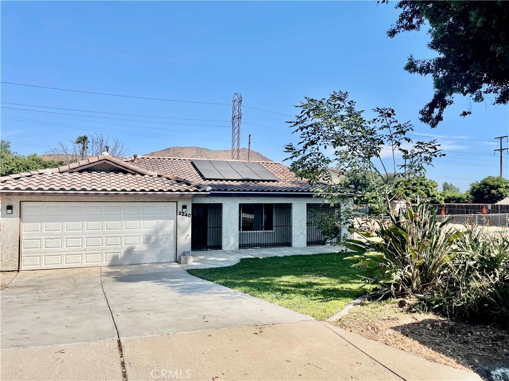2240 Gail Drive Riverside, CA 92509 - Photo 1 of 1 a front view of a house with garden