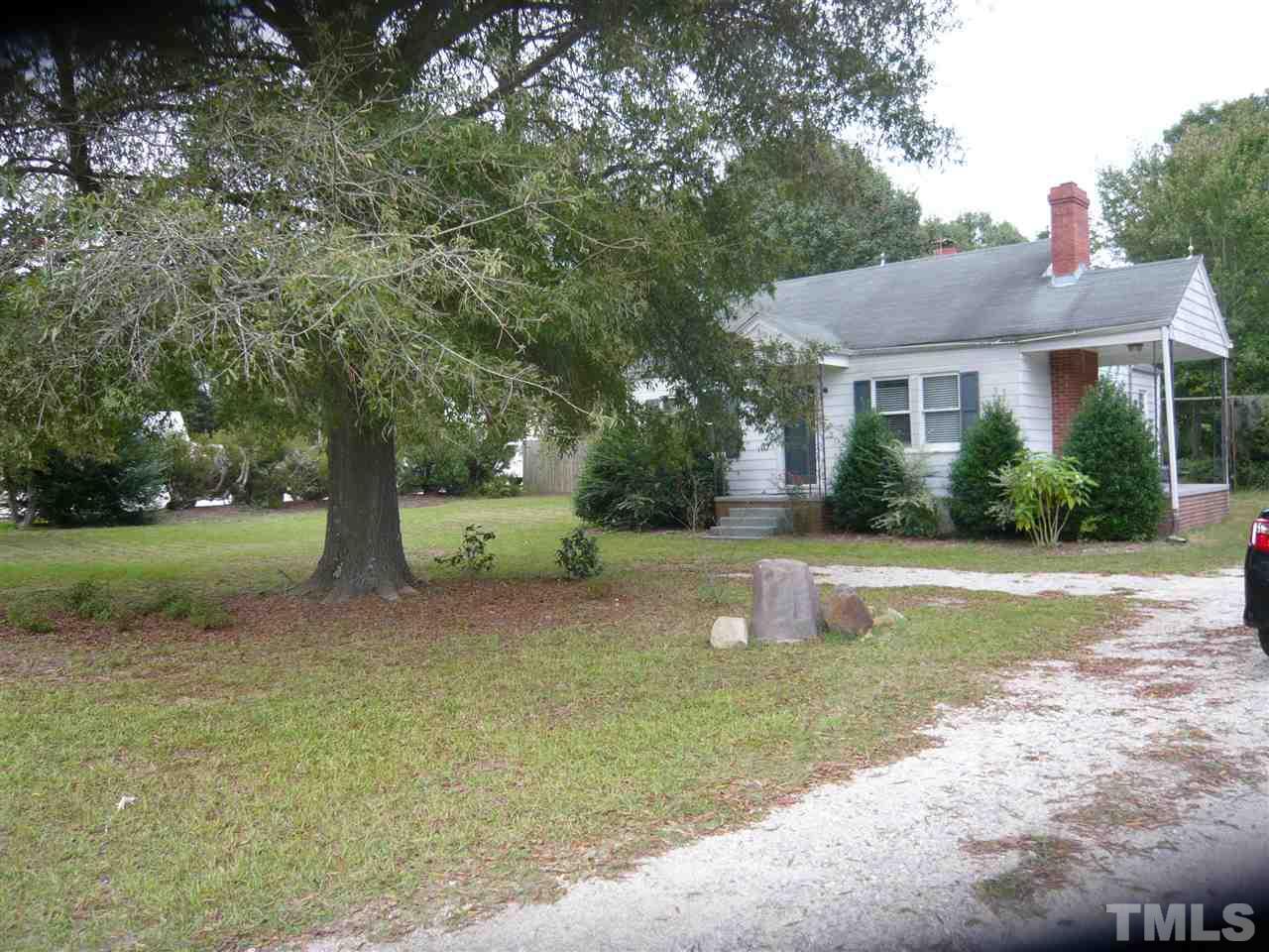 4613 Auburn Knightdale Road Raleigh, NC 27610 - Photo 2 of 25 a front view of a house with a yard and tree