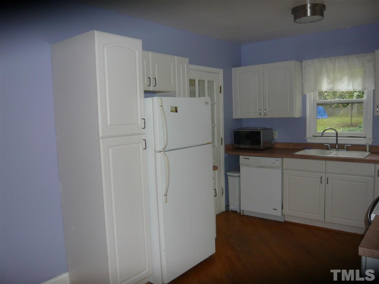 4613 Auburn Knightdale Road Raleigh, NC 27610 - Photo 17 of 25 a white refrigerator freezer sitting in a kitchen