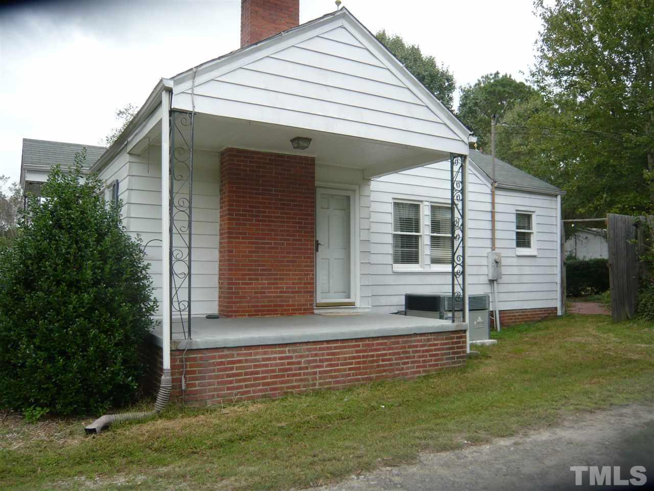 4613 Auburn Knightdale Road Raleigh, NC 27610 - Photo 3 of 25 a front view of a house with a yard