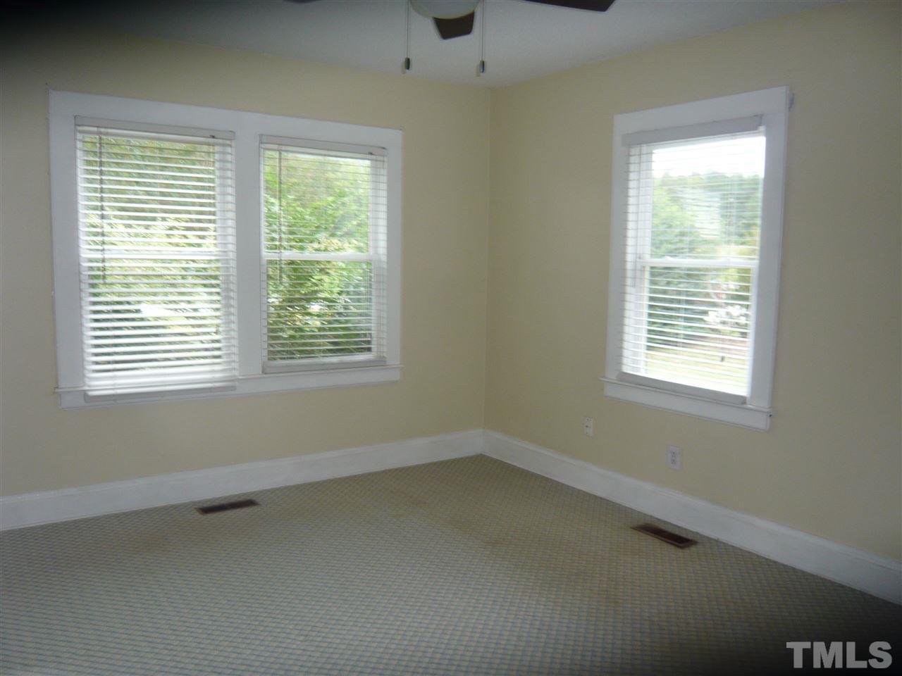 4613 Auburn Knightdale Road Raleigh, NC 27610 - Photo 22 of 25 a view of an empty room with a window