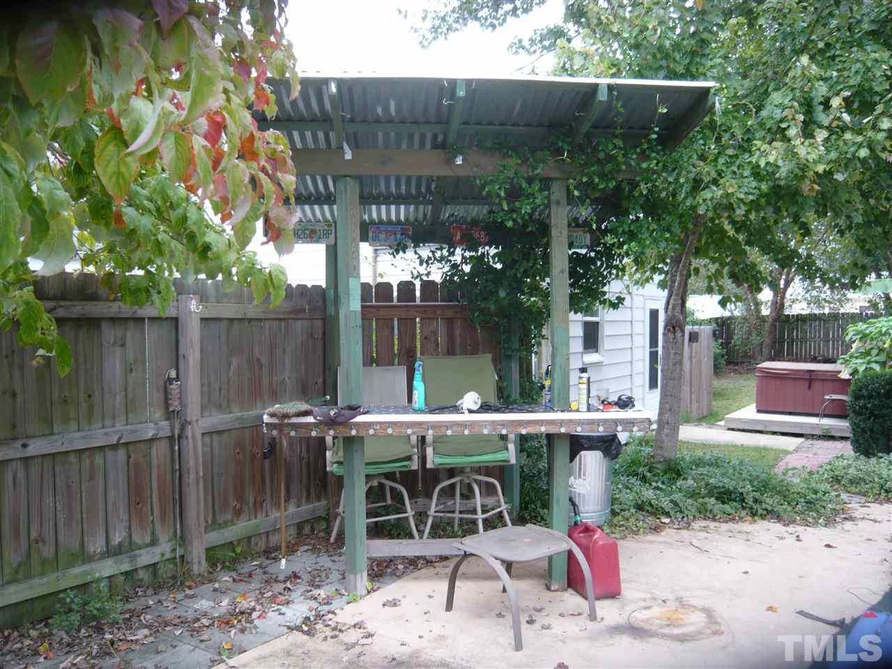4613 Auburn Knightdale Road Raleigh, NC 27610 - Photo 25 of 25 a view of a patio with table and chairs and potted plants