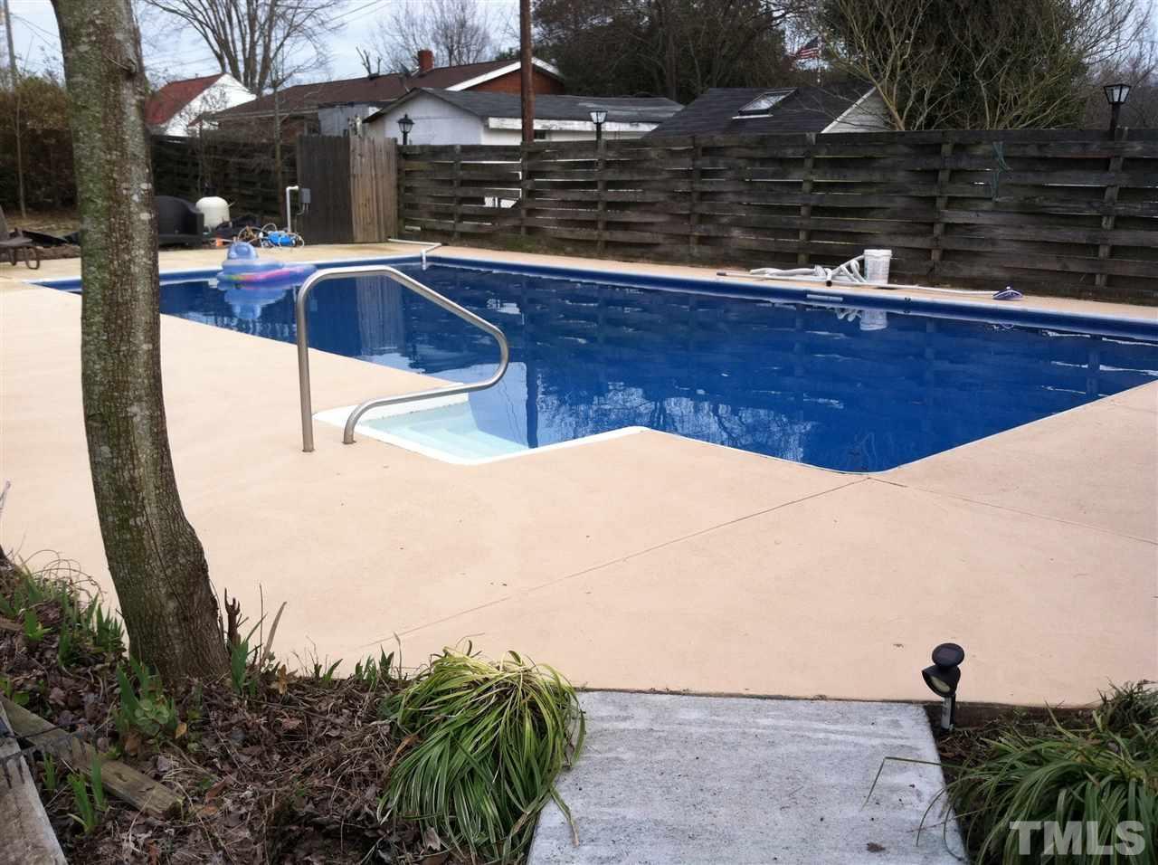 4613 Auburn Knightdale Road Raleigh, NC 27610 - Photo 5 of 25 a view of a swimming pool with a yard