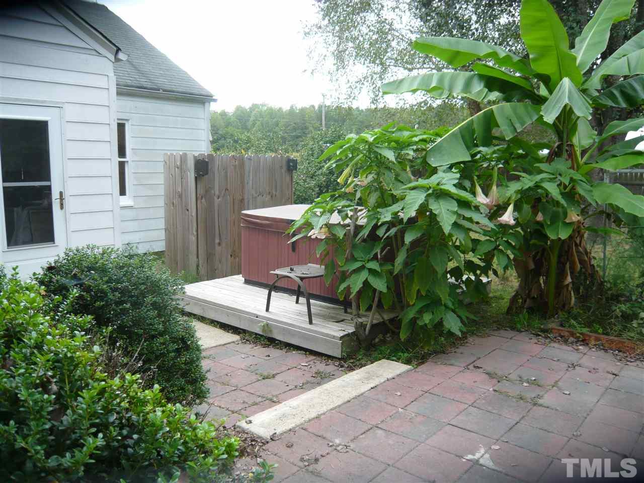 4613 Auburn Knightdale Road Raleigh, NC 27610 - Photo 6 of 25 a white bench sitting in front of a house
