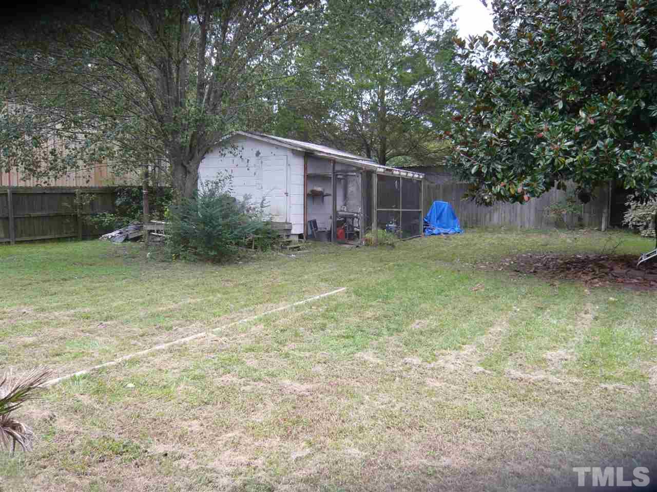 4613 Auburn Knightdale Road Raleigh, NC 27610 - Photo 7 of 25 a backyard of a house with yard and outdoor seating