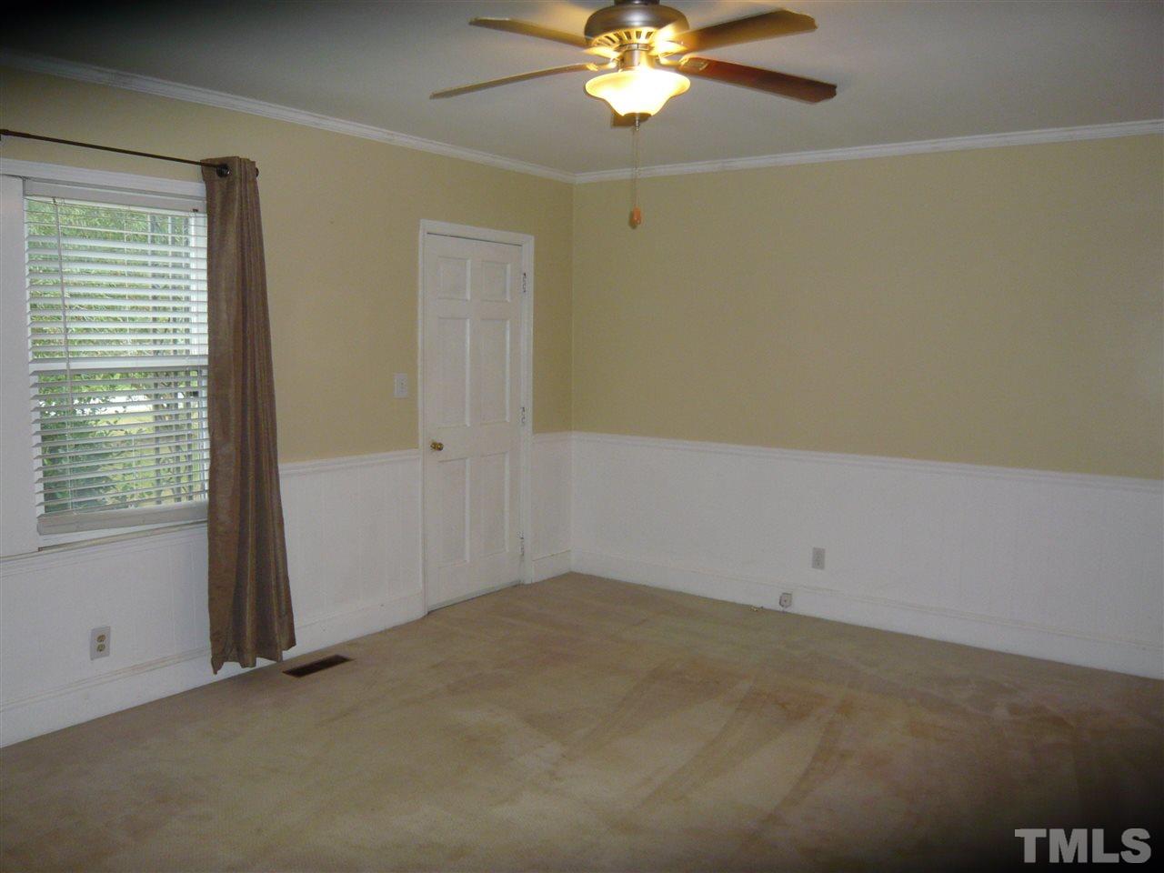 4613 Auburn Knightdale Road Raleigh, NC 27610 - Photo 10 of 25 an empty room with a window