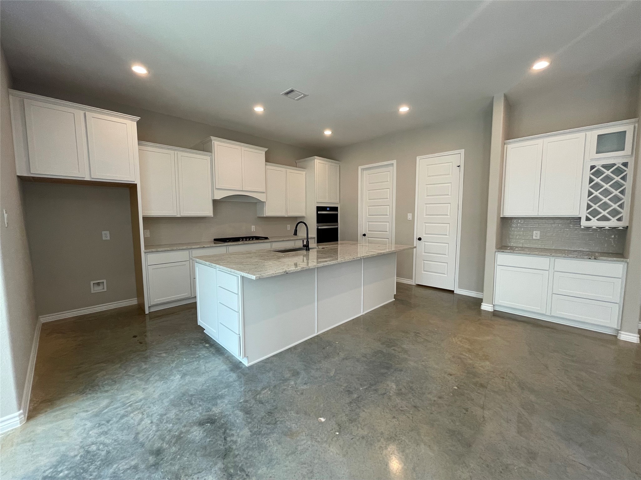 236 Dipping Vat Road Huntsville, TX 77340 - Photo 11 of 50 a large kitchen with stainless steel appliances granite countertop a stove a sink and a refrigerator