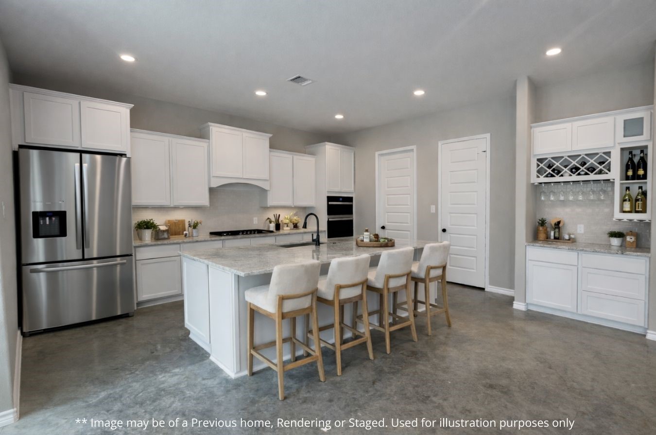 236 Dipping Vat Road Huntsville, TX 77340 - Photo 12 of 50 a kitchen with a refrigerator and white cabinets