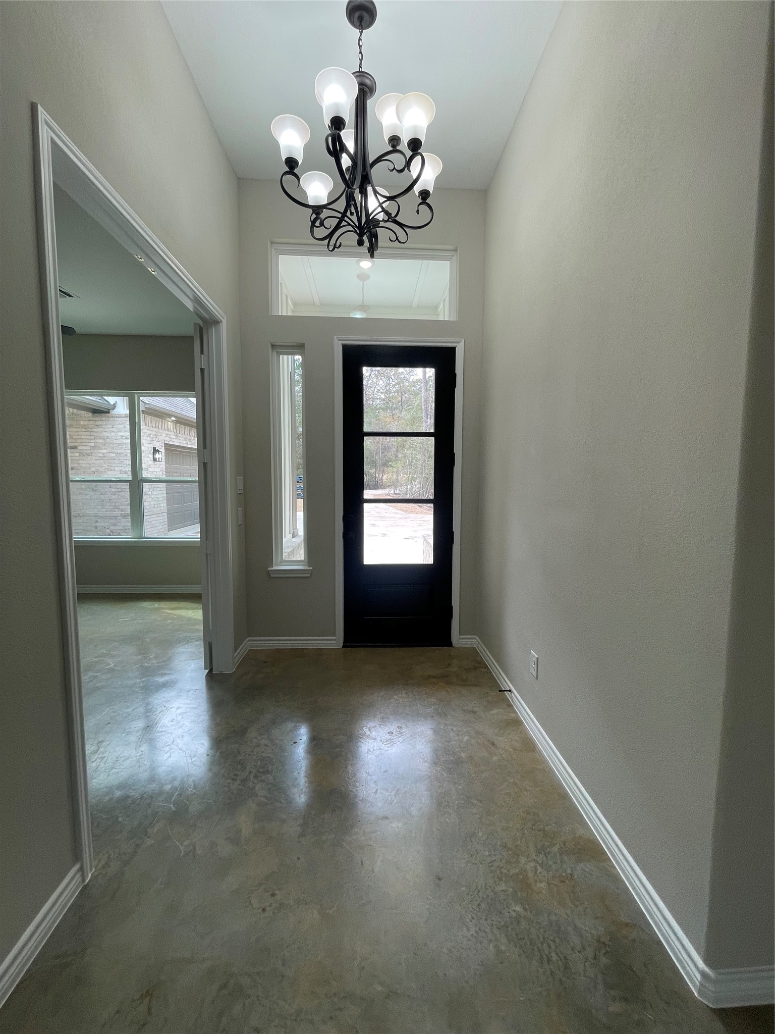 236 Dipping Vat Road Huntsville, TX 77340 - Photo 39 of 50 a view of a hallway with a chandelier