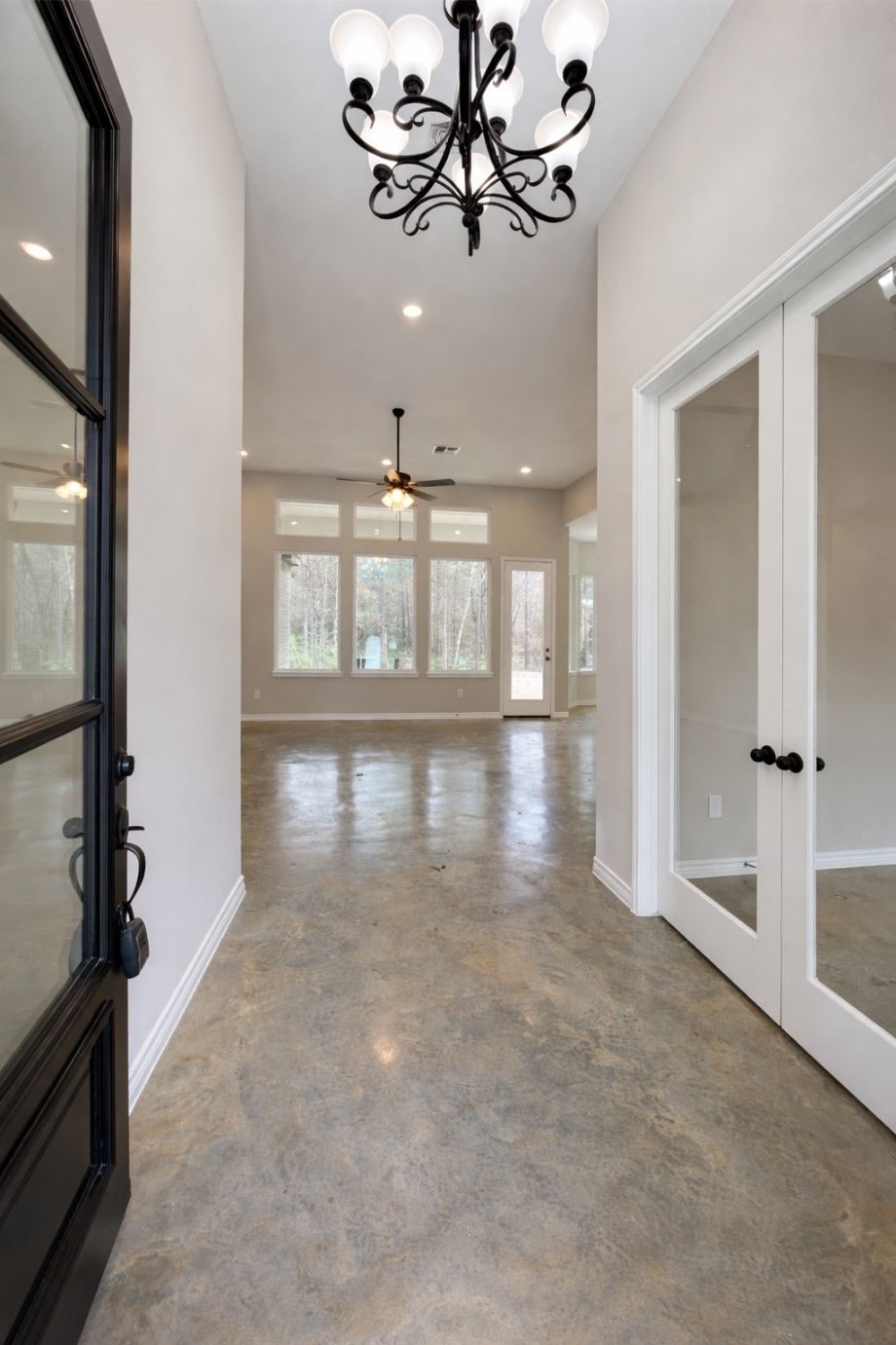 236 Dipping Vat Road Huntsville, TX 77340 - Photo 4 of 50 wooden floor in an empty room with a window