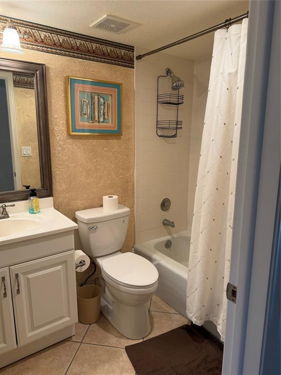 2303 Bridgewood Drive, Unit 2303 Boca Raton, FL 33434 - Photo 9 of 20 a bathroom with a sink a toilet and shower