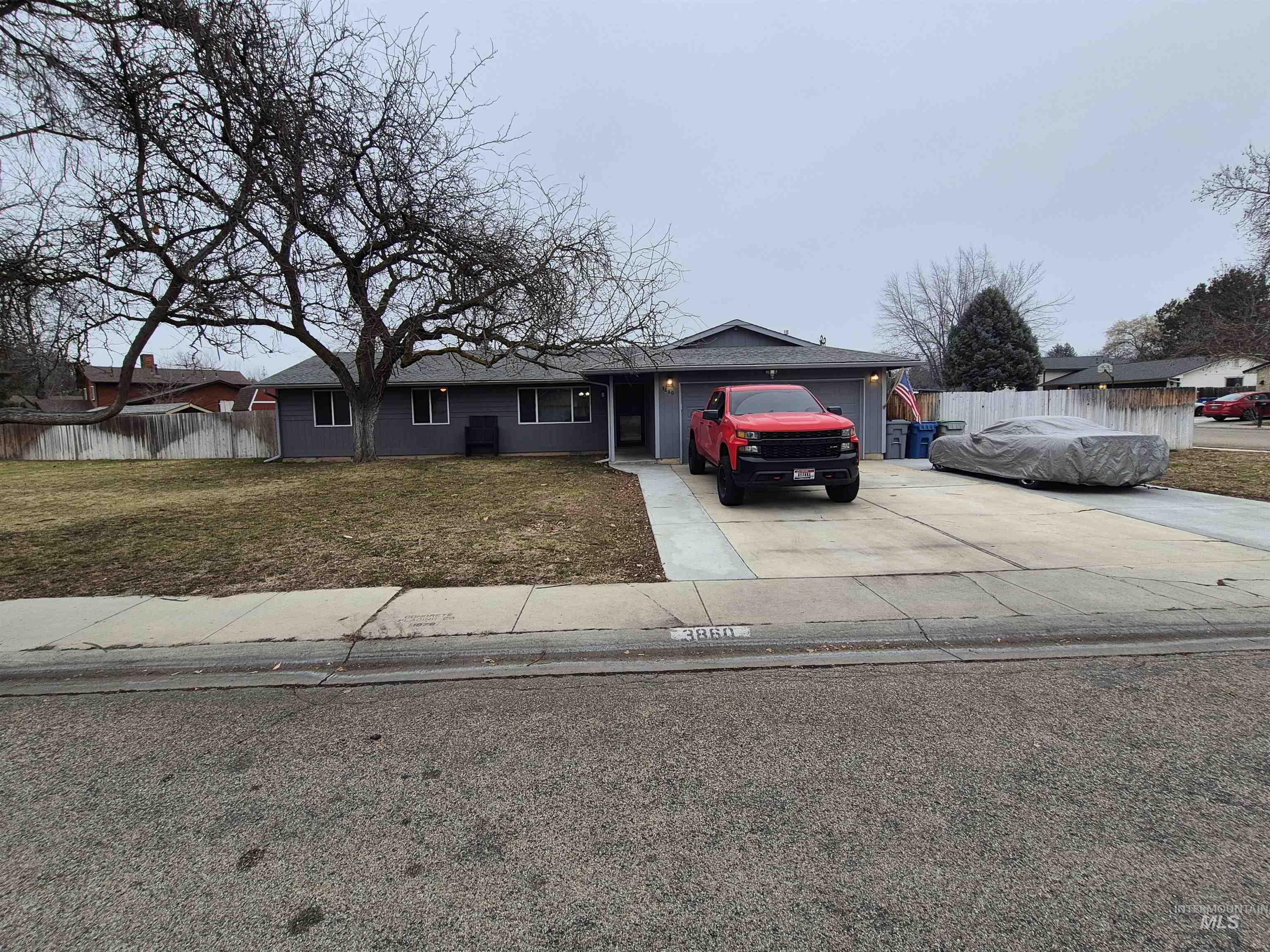 Single story home featuring driveway and an attached garage