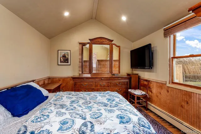 a living room with a couch and a flat screen tv