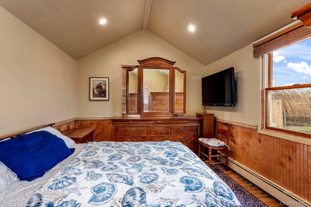20 Bayside Road Mastic Beach, NY 11951 - Photo 5 of 8 a living room with a couch and a flat screen tv