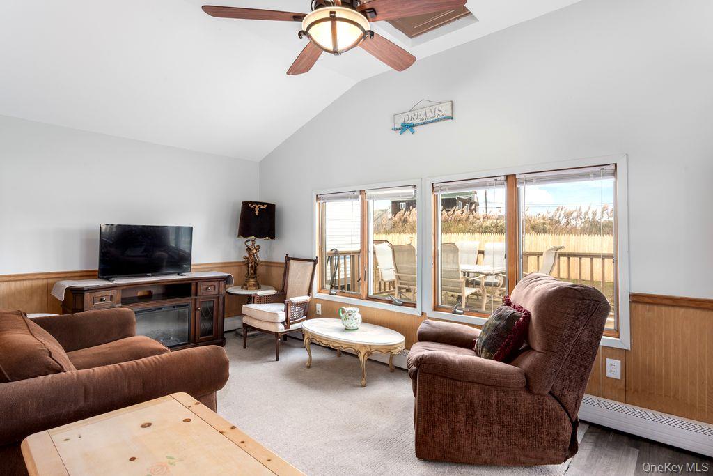20 Bayside Road Mastic Beach, NY 11951 - Photo 6 of 8 a living room with furniture and a flat screen tv