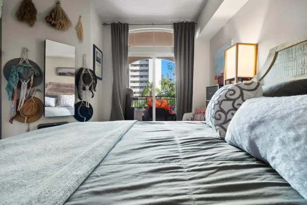 a bedroom with double bed and a window