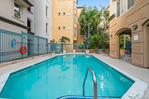 a view of a swimming pool with a yard