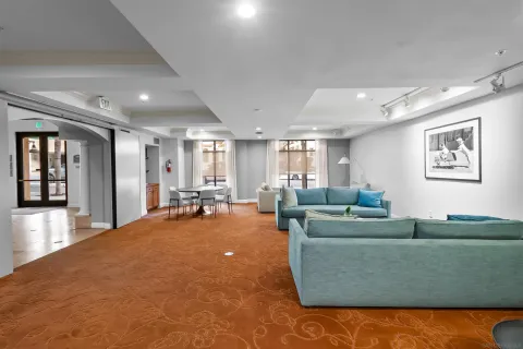 a living room with furniture and a large window