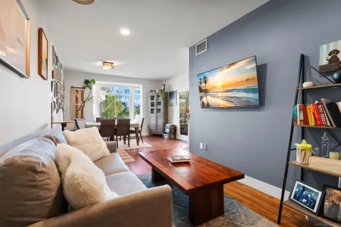 a living room with furniture and a flat screen tv