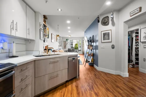 a kitchen with cabinets a sink and appliances