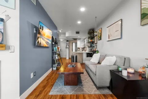 a living room with furniture and a flat screen tv