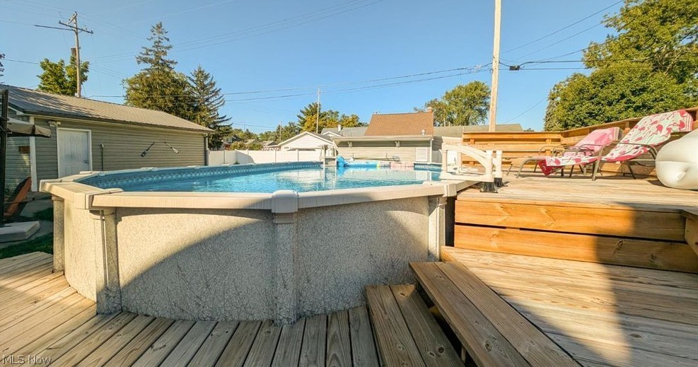 41 Poplar Street Huron, OH 44839 - Photo 29 of 37 Swimming pool featuring a deck