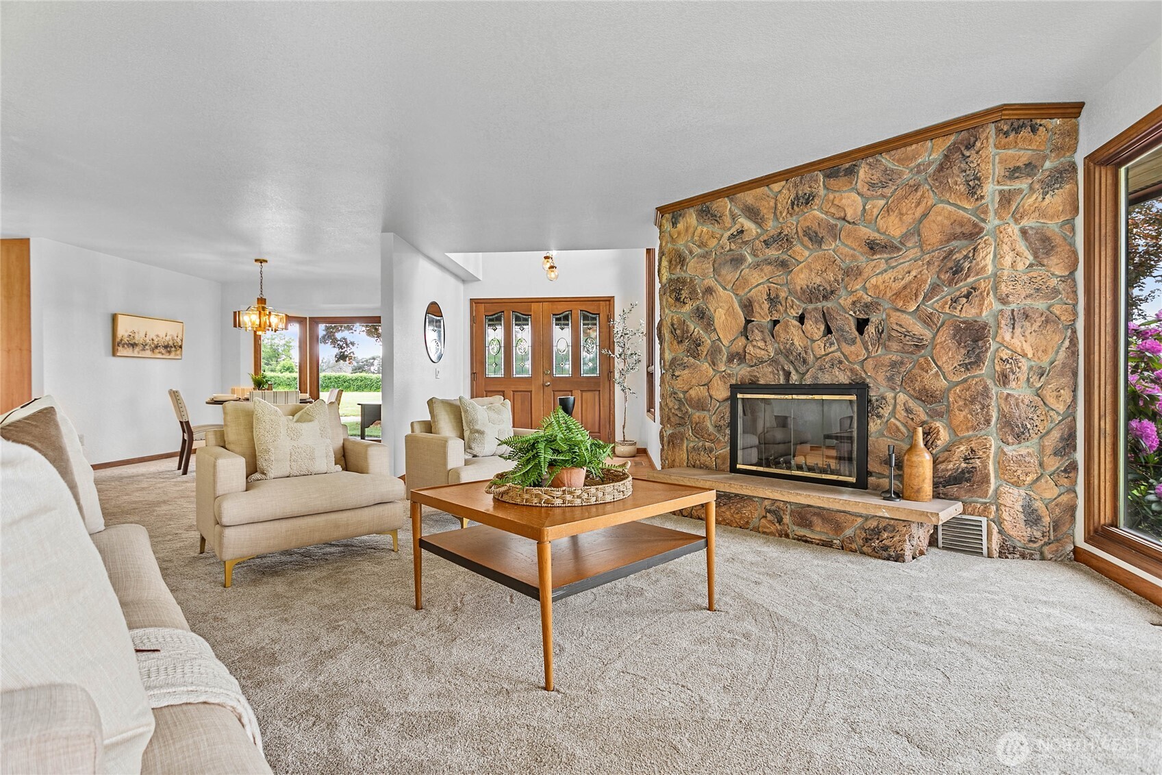 1133 East Pole Road Everson, WA 98247 - Photo 5 of 40 a living room with furniture a flat screen tv and a fireplace