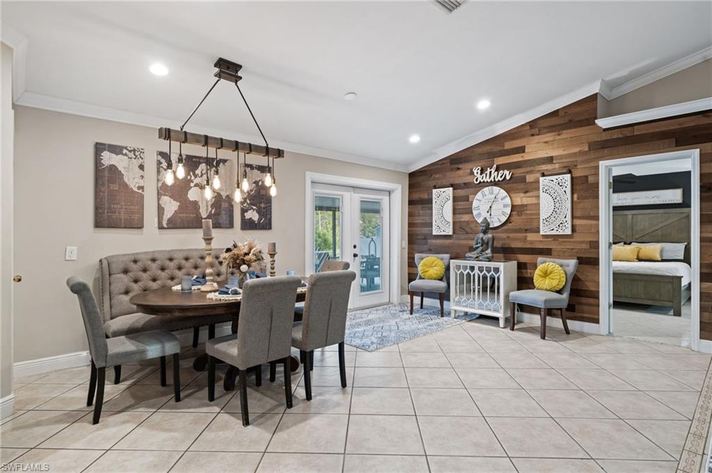 18281 Fuchsia Road Fort Myers, FL 33967 - Photo 11 of 37 a dining room with furniture and chandelier