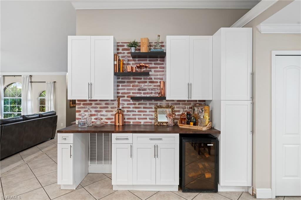 18281 Fuchsia Road Fort Myers, FL 33967 - Photo 13 of 37 a kitchen with granite countertop a sink and cabinets