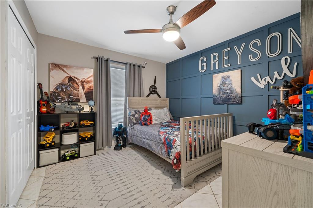 18281 Fuchsia Road Fort Myers, FL 33967 - Photo 22 of 37 a bedroom with baby crib and a window