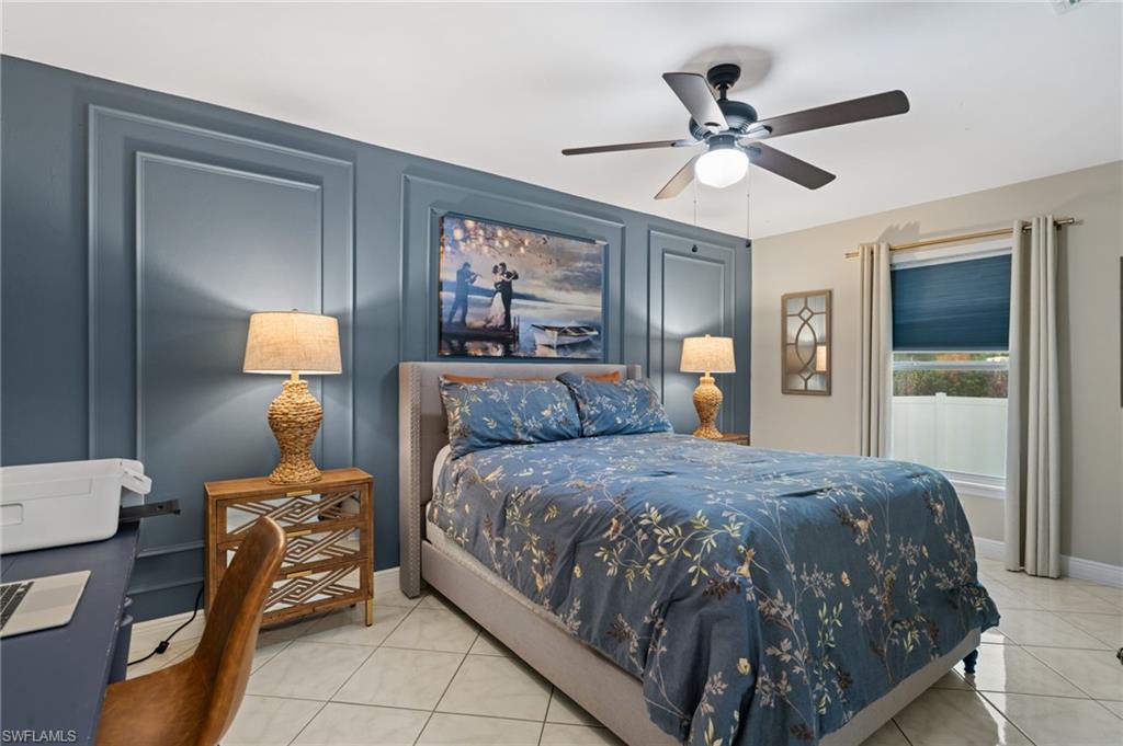 18281 Fuchsia Road Fort Myers, FL 33967 - Photo 24 of 37 a bedroom with a bed and window