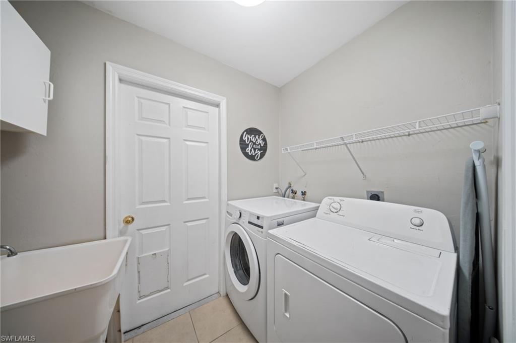18281 Fuchsia Road Fort Myers, FL 33967 - Photo 26 of 37 a utility room with dryer and washer