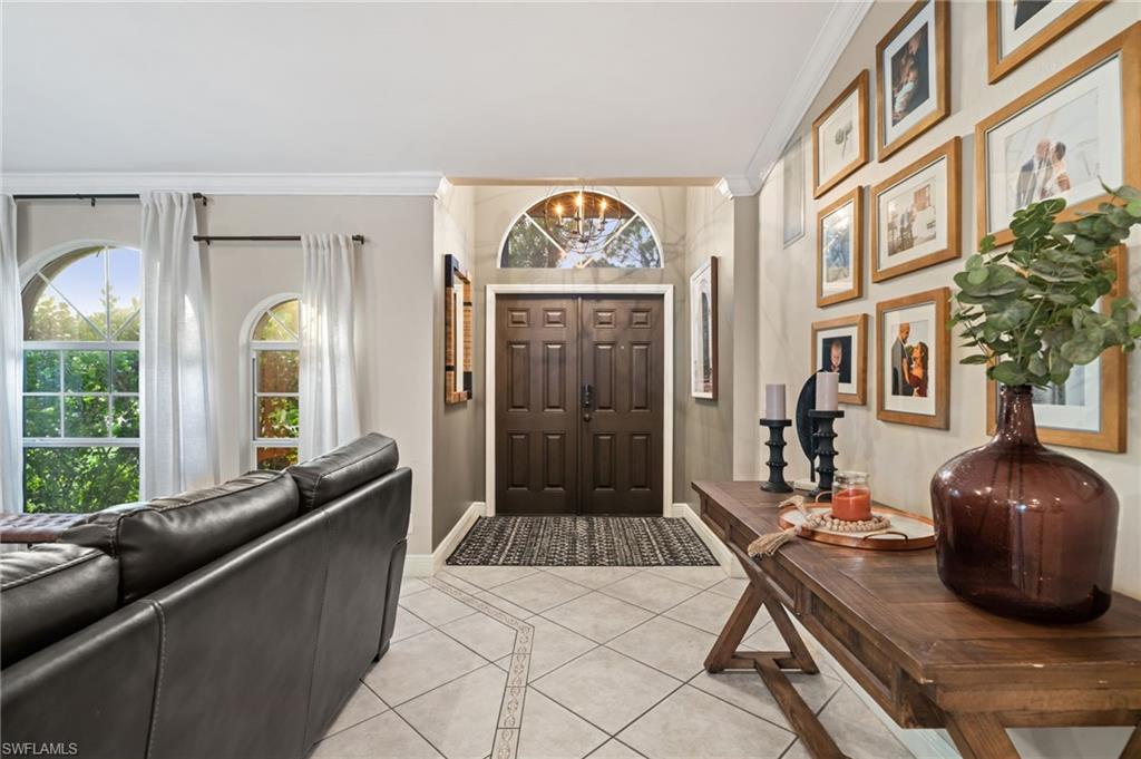 18281 Fuchsia Road Fort Myers, FL 33967 - Photo 3 of 37 a living room with furniture and a large window