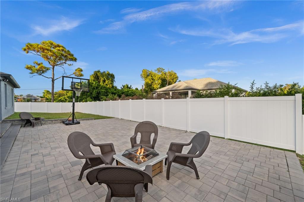 18281 Fuchsia Road Fort Myers, FL 33967 - Photo 31 of 37 a view of a chairs and table in backyard