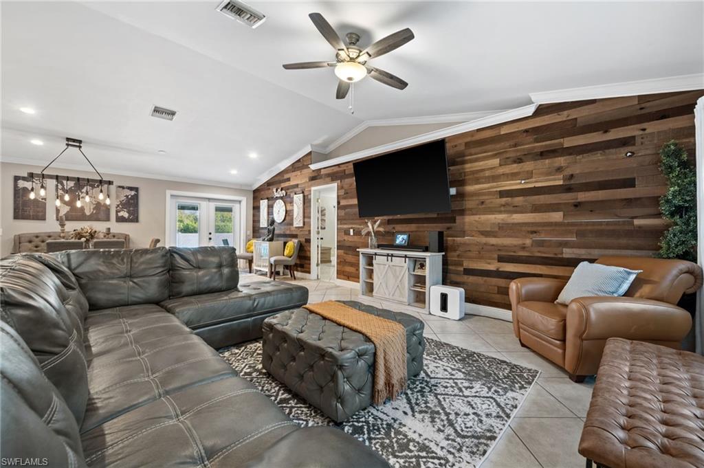 18281 Fuchsia Road Fort Myers, FL 33967 - Photo 4 of 37 a living room with furniture ceiling fan and a rug
