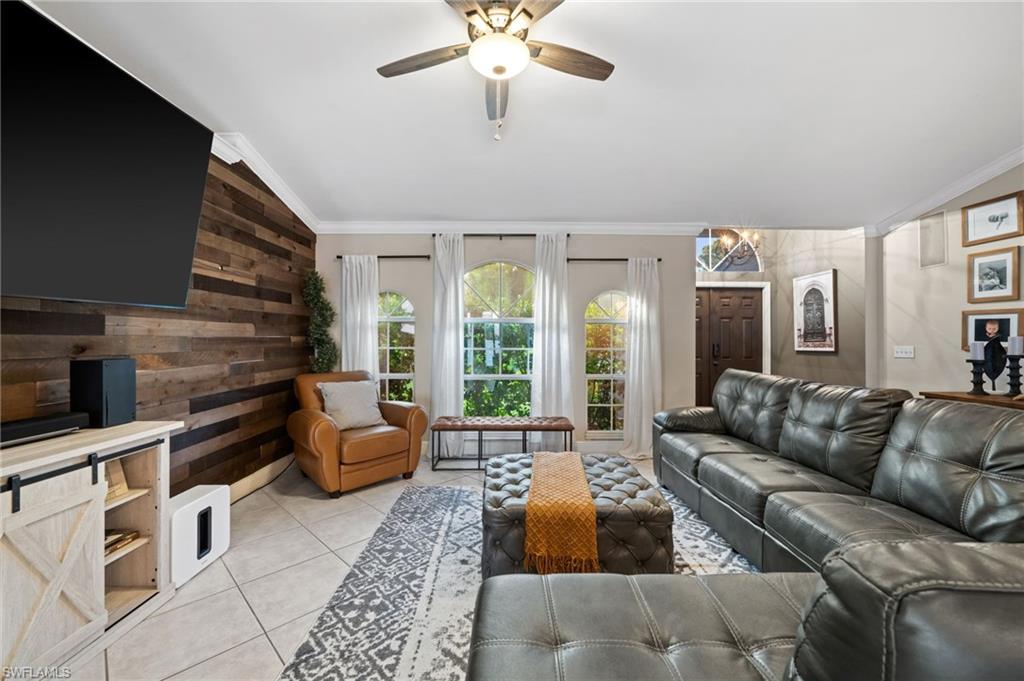 18281 Fuchsia Road Fort Myers, FL 33967 - Photo 5 of 37 a living room with furniture fireplace and flat screen tv