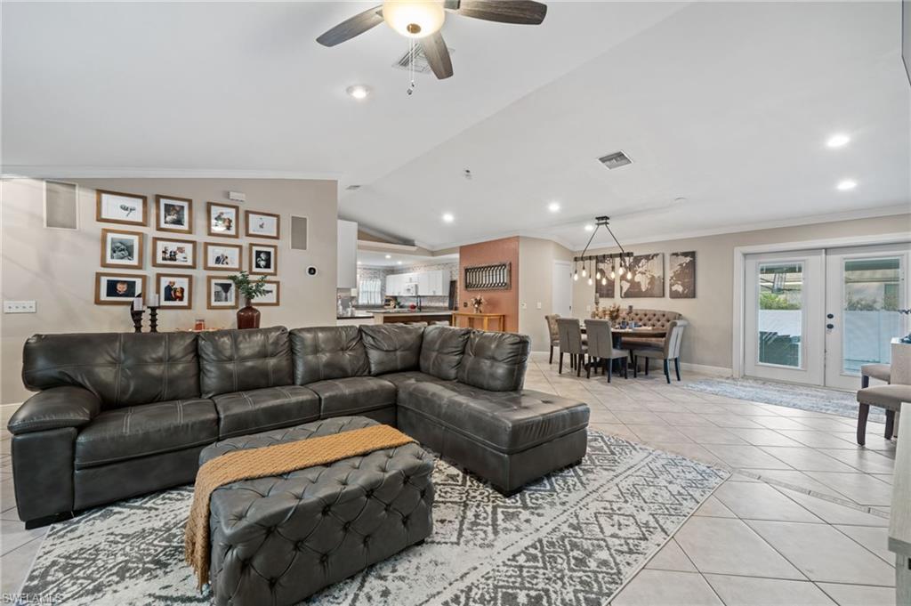 18281 Fuchsia Road Fort Myers, FL 33967 - Photo 6 of 37 a living room with furniture ceiling fan and a rug