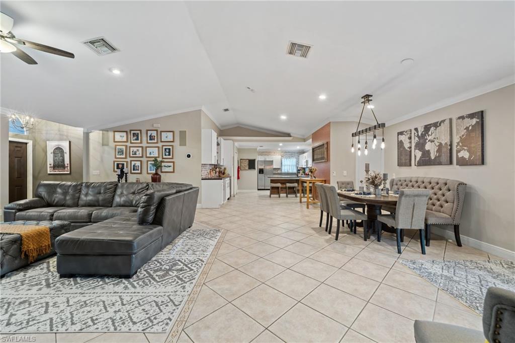 18281 Fuchsia Road Fort Myers, FL 33967 - Photo 7 of 37 a living room with lots of furniture and view of kitchen