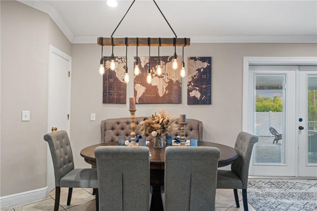 18281 Fuchsia Road Fort Myers, FL 33967 - Photo 10 of 37 a dining room with furniture and window