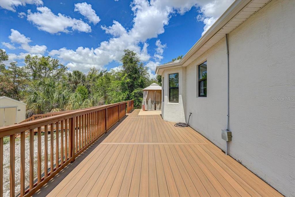 7314 Madrid Road Weeki Wachee, FL 34613 - Photo 31 of 54 a view of a house with pool on deck