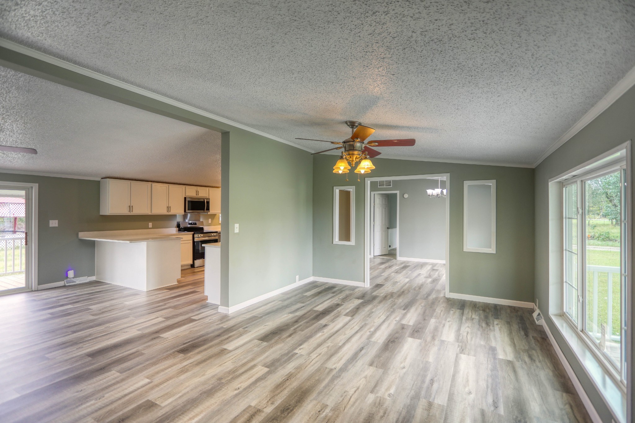 1834 Oak Grove Church Road Adolphus, KY 42120 - Photo 22 of 32 a view of empty room with wooden floor and fan