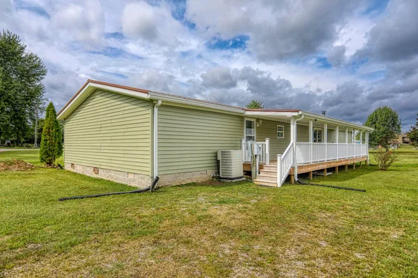 a view of backyard with a deck